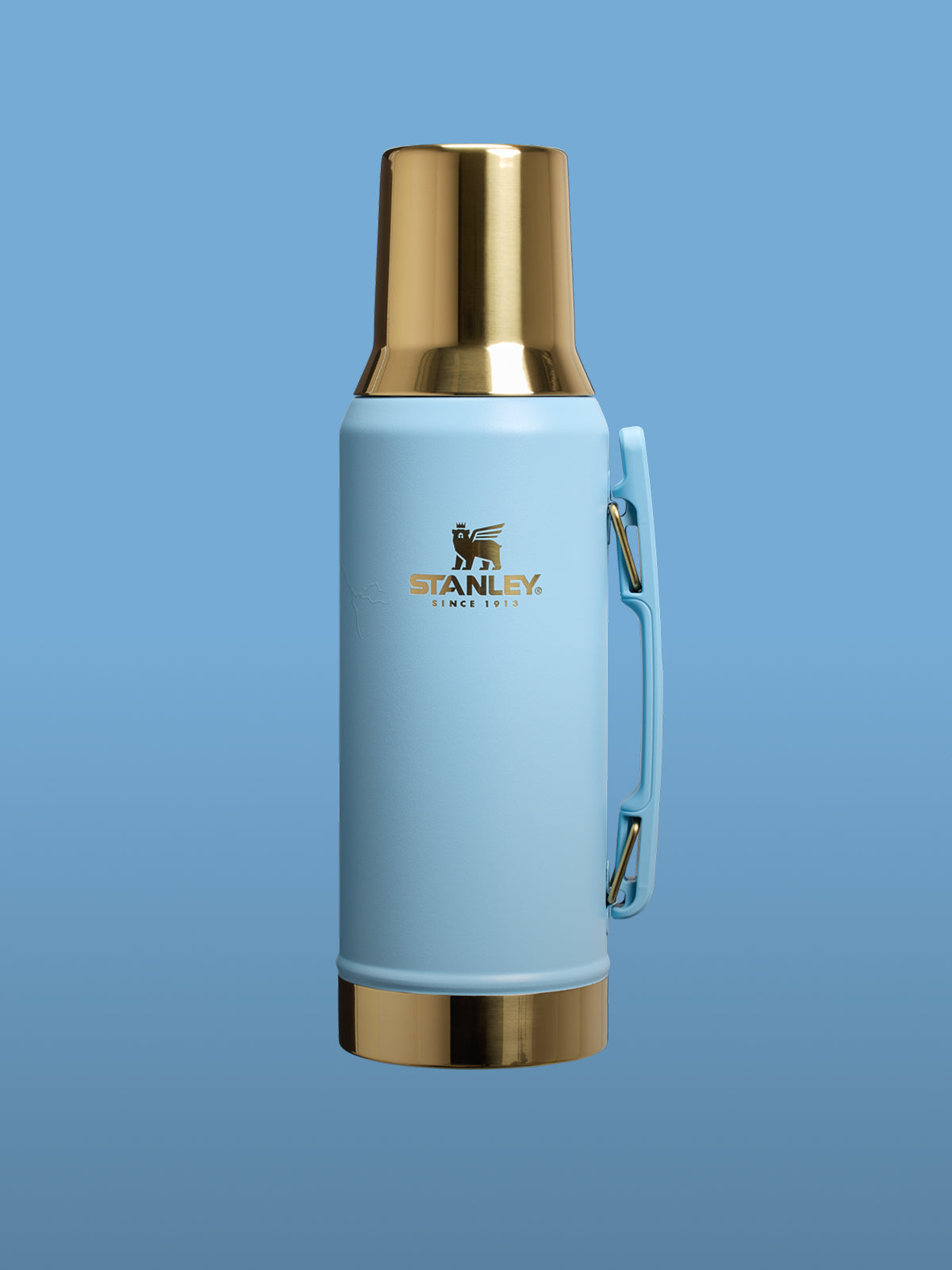 Blue thermos with gold cap on a blue background