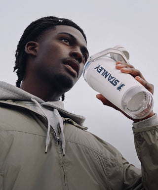 Person holding a Stanley Shaker against a neutral background